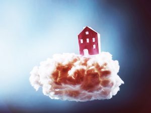 a paper house floating on a cotton cloud