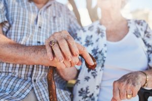 Senior couple holding hands