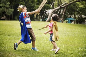 Siblings Playful Dressup Park Concept