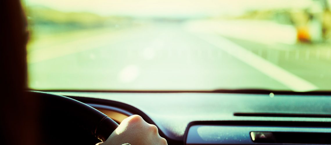 Looking over the shoulder of a woman driving