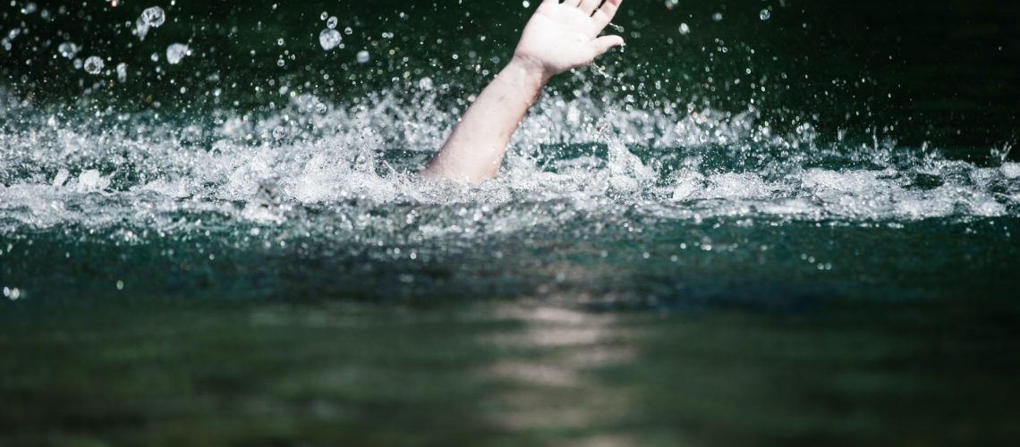 Hand of Someone Drowning and in Need of Help
