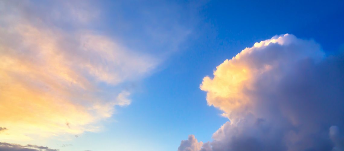 Dramatic sunset sky approaching thunderstorm clouds.
