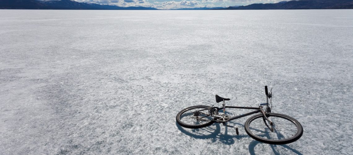 Ice bicycle frozen Lake Laberge Yukon Canada