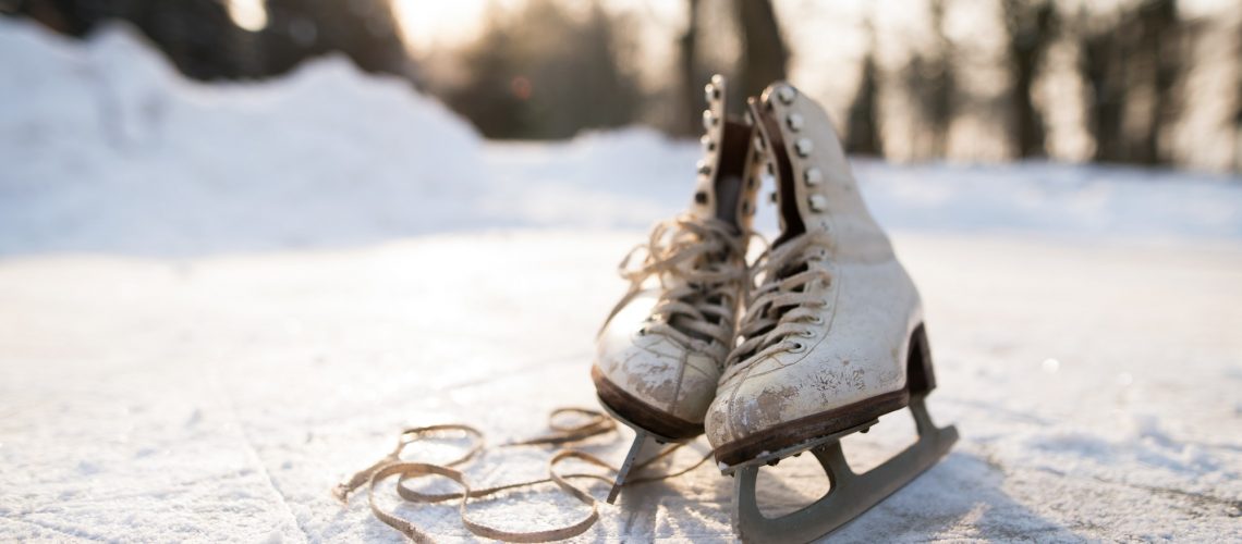 Old womans ice skates on the ice.