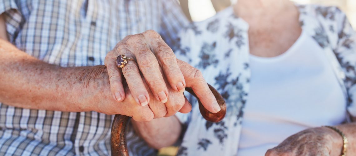 Senior couple holding hands